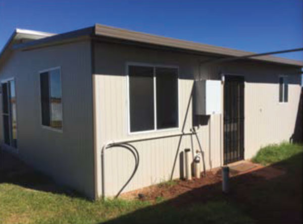 angled view of complete kit home with insulated roof & wall panels.